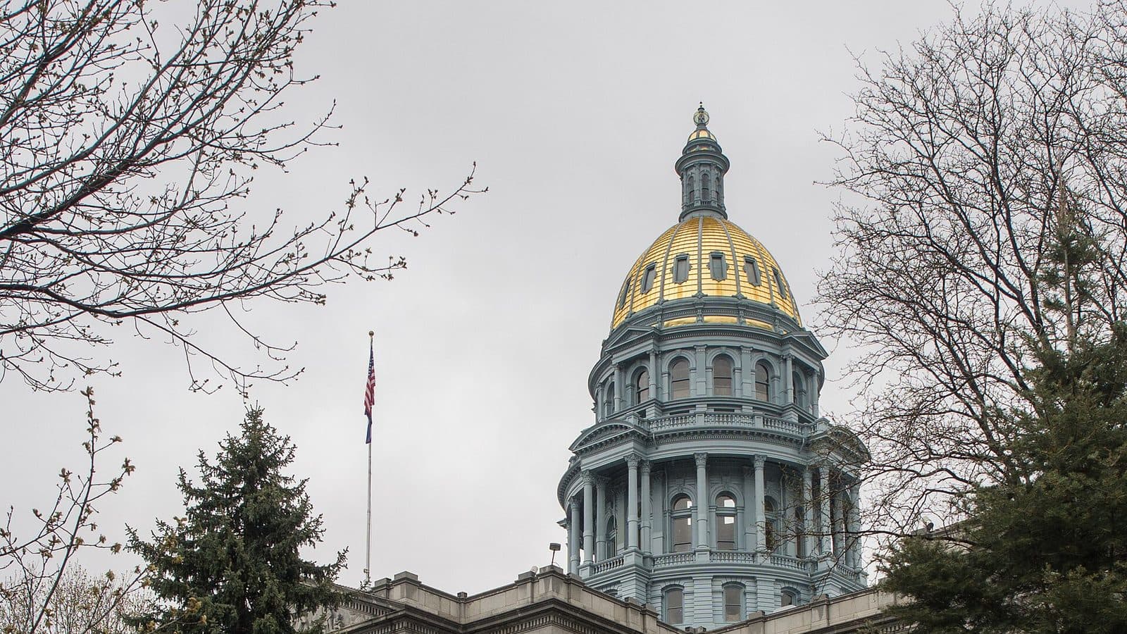 Colorado State Capitol in Denver — gold dome over the stone facade